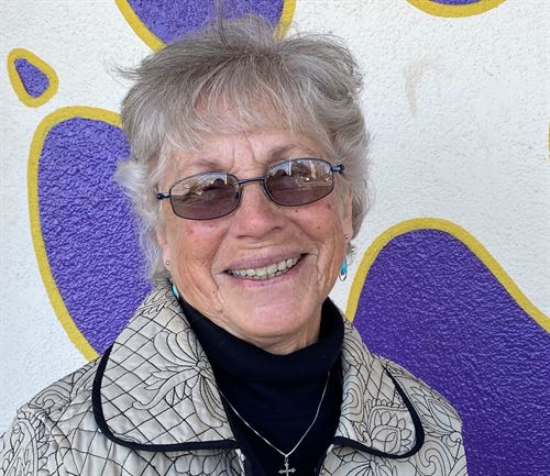 woman with gray hair and black shirt 